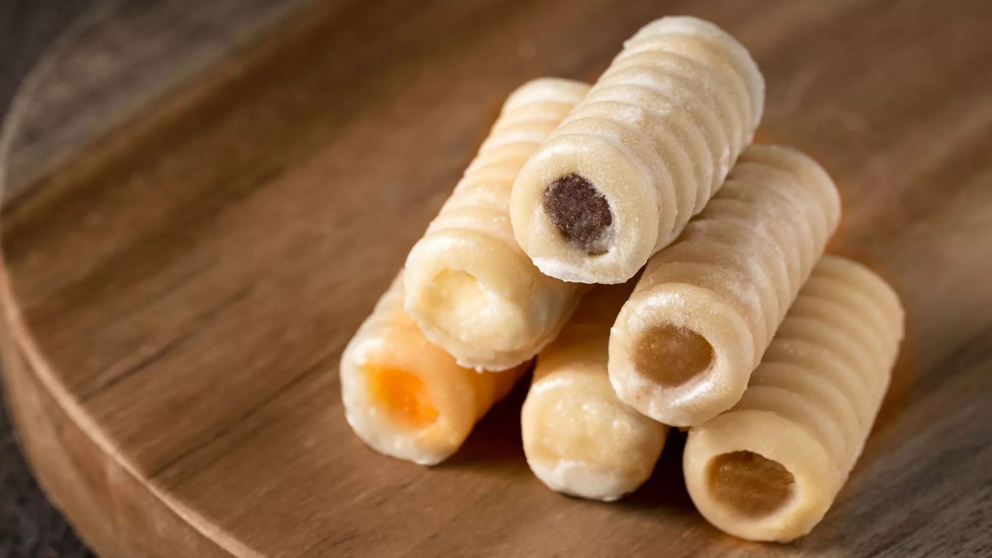 Huesos de santo rellenos de distintos sabores / Canva Huesos de santo rellenos de distintos sabores / Canva