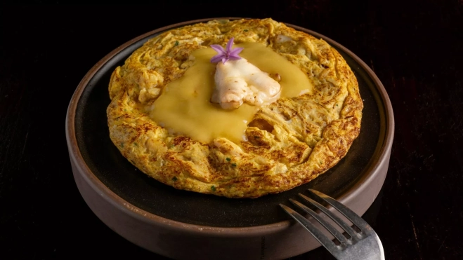 La tortilla de kokotxas del restaurante Infame en Madrid / Cedida
