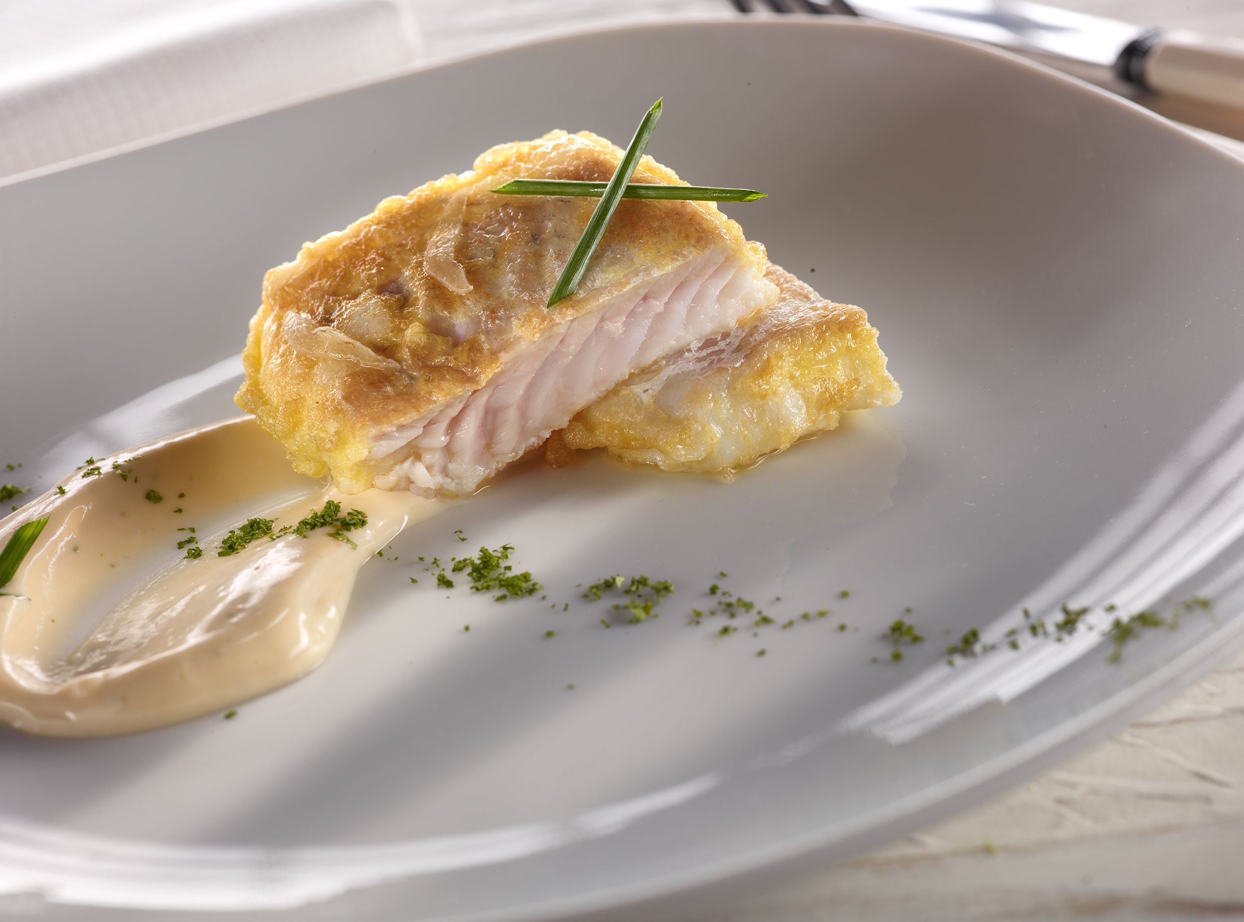 Plato de merluza del restaurante Melvin by Martin Berasategui.